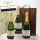 Personalised Champagne Triple Celebration Gift Pack. Three bottles of personalised champagne labeled "Mr. & Mrs. Leonard" are positioned beside a vintage-style gift box. A card with the names and a year is displayed above the bottles, suggesting a celebratory or commemorative theme. Personalised Champagne Triple Celebration Gift Pack. Three bottles of personalised champagne labeled "Mr. & Mrs. Leonard" are positioned beside a vintage-style gift box. A card with the names and a year is displayed above the bottles, suggesting a celebratory or commemorative theme.